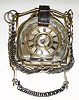 C.1890, French, Silvered brass, HORSE THEMES, mantel clock, the clock set into the center of a horse shoe, the whole supported by two different bits, chain and leather strapping. 