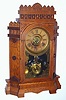 C.1885, Wm. L. Gilbert, ALTAI,  pressed oak parlor clock with canted sides and fancy top, 8-day time, strike on cathedral gong, and with alarm. 