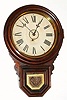 C.1900, E. Ingraham, Bristol, Conn, DEW DROP, 8-day timepiece, in a grained poplar case and with partial label on the rear. 