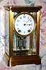C.1910, Seth Thomas Clock Co., EMPIRE No. 0, in a polished brass, 4-glass case, 8-day time and gong strike. 