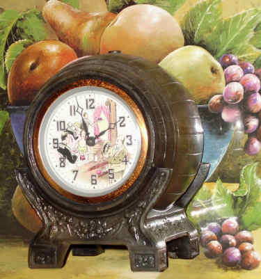 C.1938, United Electric Clock Corp, Brooklyn, NY, WINE BARREL animated novelty, dial with a bar scene showing a bartender shaking a drink, the canister shaking with each tick of the clock; barrel is patinated spelter. — Antique Clocks Price Guide