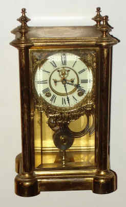 C.1894, Ansonia Clock Co., "Symbol Extra", 8-day time/strike crystal regulator mantel clock with open escapement on the dial. — Antique Clocks Price Guide
