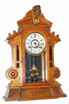 C.1890, New Haven Clock Co., "CORSAIR", golden oak cased parlor clock, 8-day time and strike with heavy beveled glass in door. — Antique Clocks Price Guide