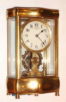 C.1910, English, Eureka Clock Co., Ltd, London, SERPENTINE 4-GLASS case, serial No. 7035, battery powered clock with large balance wheel supported in ball bearings. — Antique Clocks Price Guide