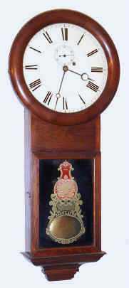 C. 1874 Ansonia Brass and Copper Co., Ansonia CT, uncommon OFFICE REGULATOR, weight driven with maintaining power, time only, walnut regulator wall clock, with pendulum forward (S. B. Terry style movement), 8-day. — Antique Clocks Price Guide
