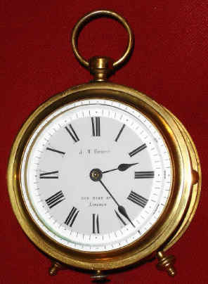 C.1886, French, "R. E. D." Cylinder or Drum shaped carriage clock, 1-fusee, two-plane lever, brass case consisting of a front and rear bezel separated by 6 turned pillars and a cylinder shaped glass allowing full of the rare movement. Porcelain dial bears the name: J. H. Hewitt, 308 High St, Lincoln. — Antique Clocks Price Guide