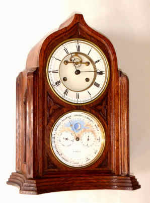 C.1890, French, Brocot and Delettrez, for the English Market, double dial perpetual calendar in an oak and veneer case of Gothic style, with open escapement on the porcelain dial. — Antique Clocks Price Guide