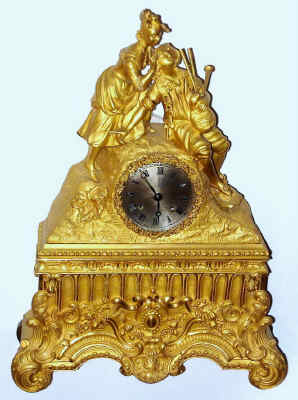 C.1830, French, Gilt Bronze figural clock, two lovers, a male playing the bag pipes, and the girl with her hands over his eyes as if asking him to guess who it is. — Antique Clocks Price Guide