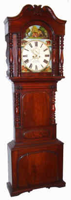 C.1840, English, S. J. Bibby, Carnarvon [Wales], 2-Wt, 8-day tall case with animated dial, a monkey swinging from tree to tree to avoid a lion with "blinking eyes", in a wide mahogany case typical of the North country in England. — Antique Clocks Price Guide