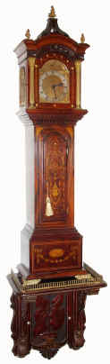 C.1900, English, Albert Barker, 5 New Bond St, London, Dwarf Tall Clock, mahogany, with profuse inlay, and on a shelf from the same period, with some Nouveau influence. The movement signed on the rear plate, "Made in France, especially for Albert Barker, London", and the dial signed as in the headline. — Antique Clocks Price Guide