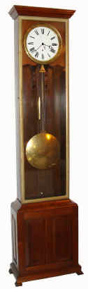 C.1880, American Jeweler's Regulator, in a walnut case with brass trim. The consignor bought this out of a French Quarter residence many years ago, and the case is attributed to Stanislaus Fournier of New Orleans. Note brass trim all around the door, and unusual grid pendulum that is actually pinned for proper temperature compensation [many grids are not]. — Antique Clocks Price Guide