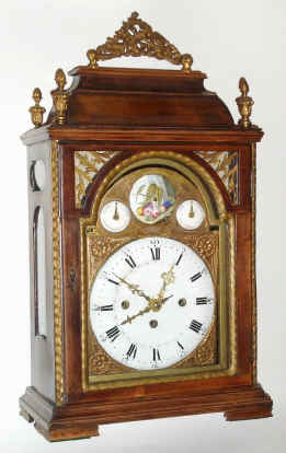 C.1800, Austrian, Grand Sonnerie, Crown Verge Bracket clock, with calendar, chain fusee on time, 5 to 7 day duration, qtr striking on 2 bells, w/ faux pendulum aperture, in a primitive solid pine case with flame finials. — Antique Clocks Price Guide