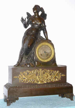 C.1830, French, Large Bronze figural clock, a nymph with the wings of a moth, setting on a large rock, which contains the clock, a large countwheel unit, silk thread. — Antique Clocks Price Guide