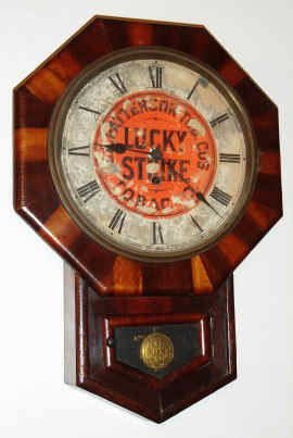 C.1900, New Haven Clock Co, for R. A. Patterson Tobacco Co, LUCKY STRIKE Advertising timepiece, in rosewood and mahogany case. — Antique Clocks Price Guide