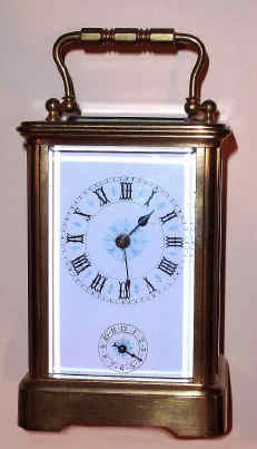 C.1900, French Brass Cased Carriage timepiece with alarm, and with a fancier dial with blue accents, in a Corniche case. — Antique Clocks Price Guide