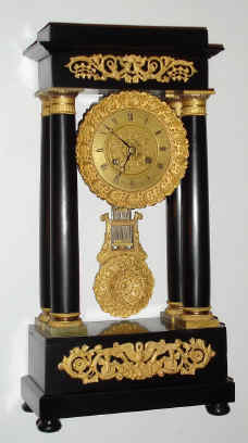 C.1860, French, D. B and Cie, Paris, 4-Col Empire style mantel clock, 8-day time and bell strike, the ebonized case with gilt accents. — Antique Clocks Price Guide