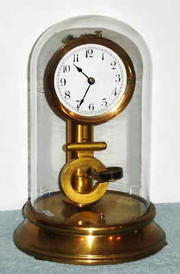 C.1910, Warren Clock Co., Ashland, Mass, battery clock, often called MYSTERY TIMEPIECE, since the magnetic impulse concept was so new at the time, pat by Henry Warren in 1909. — Antique Clocks Price Guide