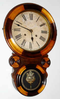 C.1915, Waterbury Clock Co., "BAHIA", mosaic, figure 8 wall clock, 8-day, time and strike. — Antique Clocks Price Guide
