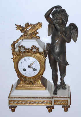 C.1900, French, Japy Freres, 8-day figural mantel clock, bell strike with porcelain dial, a figure of Cupid, with empty quiver. — Antique Clocks Price Guide