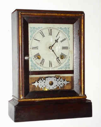 C.1883, Waterbury Clock Co., COTTAGE EXTRA, Gilt, 8-day time and strike, rosewood veneer case. — Antique Clocks Price Guide