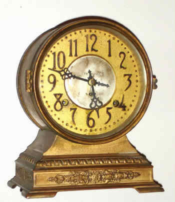 C.1910, Seth Thomas Clock Co., ELECT, metal cased mantel clock, brass drum on top with patinated spelter base, 8-day time and strike. — Antique Clocks Price Guide