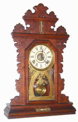 C.1895, E. Ingraham and Co., Premium Oak Gingerbread, 8-day time, strike and alarm with thermometer at top and level in base. — Antique Clocks Price Guide