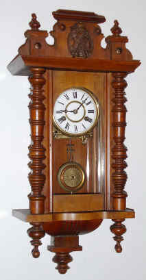C.1905, German, Spring Regulator, in the Alt Deutsch style, 8-day with porcelain dial, walnut case. — Antique Clocks Price Guide