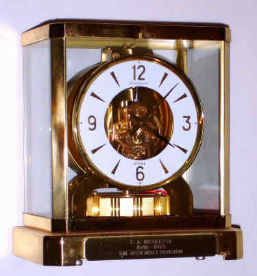 C.1973 [dated], Swiss, LeCoultre, ATMOS, or self winding, perpetual running clock, Calibre 528-8, with lift-out front glass, serial No. 381580. A presentation to F. A. Nicoletta, for 25 years of service, 1948-1973, GM Assembly Division. — Antique Clocks Price Guide