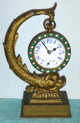 C.1900 New Haven Clock Co., "Astoria", 30-hour ball watch on a dolphin stand. — Antique Clocks Price Guide