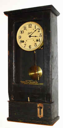 C.1940, Simplex Time Recorder Co., Gardner Mass, Model T10-R3, heavy oak cased time punch clock with large double spring time only movement advancing a double wheel hour and minute time punch mechanism in the base. — Antique Clocks Price Guide