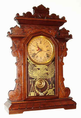 C.1884 E. Ingraham and Co., "Index Calendar", 8-day time/strike calendar shelf clock. — Antique Clocks Price Guide