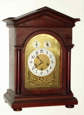 C.1915, German, Junghans, Westminster chime bracket clock, mahogany case, peaked top, with chime-silent and F/S dials in the arch. — Antique Clocks Price Guide