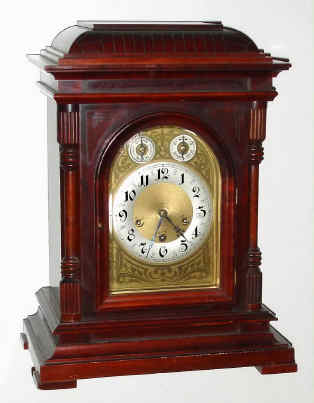 C.1915, German, Junghans, Westminster chime bracket clock, mahogany case, bell molded top, with chime-silent and F/S dials in the arch. — Antique Clocks Price Guide