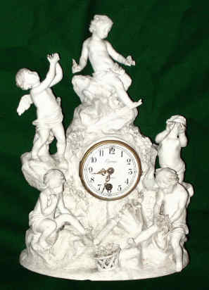 C.1890, French, Pottery figural clock in the Parian style, white with fine detail, the movement a typical Japy timepiece, 8-day spring depicting 5 cherubs at play. — Antique Clocks Price Guide