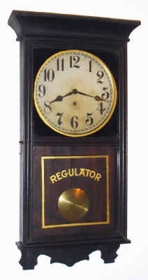 C.1913, William L. Gilbert Clock Co., "University", 8-day wall timepiece. There are the remains of label on the back that read: " No. 301?". — Antique Clocks Price Guide