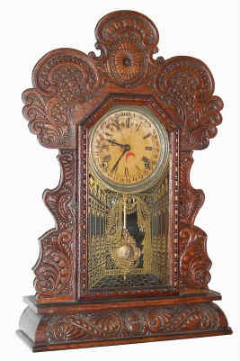 C.1910, E. Ingraham GILA, Time, strike and calendar pressed oak gingerbread clock, 8-day. — Antique Clocks Price Guide