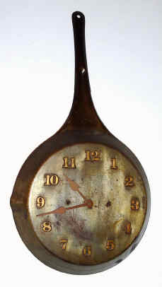 C.1905, Waterbury Clock Co., 30-hour alarm timepiece novelty mounted in a steel frying pan with raised numerals, riveted to the pan. — Antique Clocks Price Guide