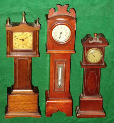 Lot of 3 Mini Tall clocks: — Antique Clocks Price Guide
