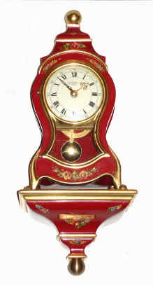 C.1975, German, 8-day time and bell strike small Neuchatel style clock with bracket base, red. — Antique Clocks Price Guide
