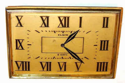 C.1920, Elgin Watch Co, 8-day jeweled lever desk clock, in a rectangular Deco style case with raised and gilt Roman numerals. — Antique Clocks Price Guide