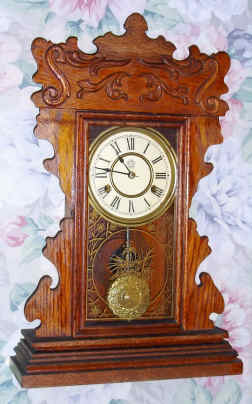 C.1900, New Haven Clock Co., "Patrol Line", 8-day time/strike gingerbread mantel clock. — Antique Clocks Price Guide