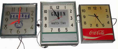 [Three items] Mixed lot of 3 metal case advertising 110v wall clocks. — Antique Clocks Price Guide