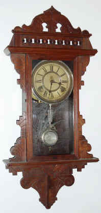 C.1891, Waterbury Clock Co., "Lawrence", 8-day time and gong strike hanging gingerbread clock, with restored top. — Antique Clocks Price Guide