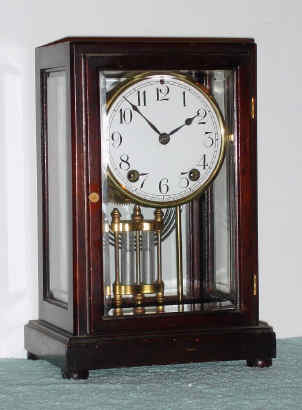 C.1917, New Haven Clock Co., "TUXFORD", "5-glass" mantle regulator, a slender mahogany case with beveled glass all around, and faux mercury pendulum, large round movement with rack and snail on rear plate. — Antique Clocks Price Guide