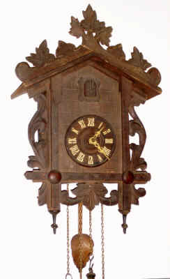 C.1920, German, 2-wt, Black Forest Cuckoo, in a carved leafy case with top rail of leaves. — Antique Clocks Price Guide