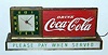 C.1950, Coca Cola, 110v, lighted advertising sign with original electric clock that was most likely used in a drug store soda fountain.