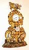 C.1850, French, Small Repousse w/ porcelain flowers, fantasy timepiece, movement signed Jeanperin, a' Paris, No. 7701.
