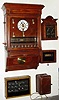 [5 Pieces] C.1890, Seth Thomas (Mov't) Burglar Alarm Instrument, Style C, mahogany cased wall clock with 8 station servant call system, along with 4 auxiliary / remote boxes, which appear to have been added to the system.