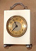 C.1900, French, Mini Carriage Timepiece, the case of ivory, and the feet and handle of sterling, 8-day.