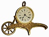 C.1885, Ansonia Clock Co., Wheelbarrow novelty timepiece, a rear-wind "Bee" movement in a cast brass holder simulating a wheel barrow, with turning front wheel, design patent Apr 23,1878.